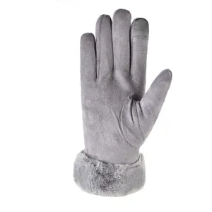 Detail view of grey winter women gloves with touchscreen fingertips and soft plush fur cuff.