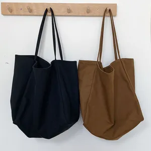Minimalist canvas tote bag with large capacity, casual shoulder bag for women daily use.
