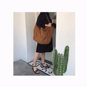 Minimalist brown canvas shoulder bag for women, large capacity slouchy hobo tote bag daily use.
