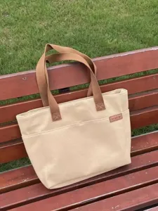 Canvas tote bag for women, large capacity shoulder handbag for commuting and school use.