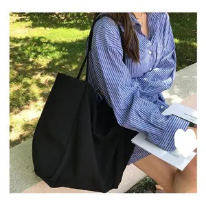 Simple black canvas tote bag for women, large capacity casual shoulder bag daily use.