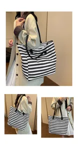 Black and white striped canvas tote bag detail view showing large capacity and handles.