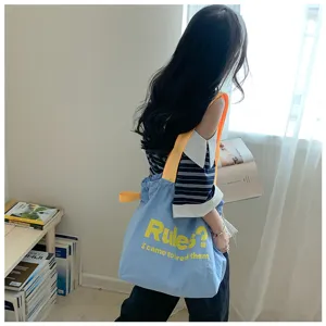 Casual blue canvas shoulder tote bag, stylish large capacity daily handbag for women.