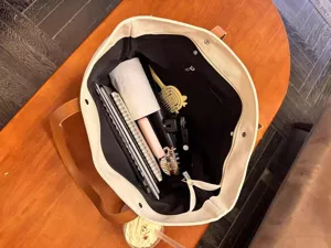 Spacious canvas tote bag for women, large capacity daily commuting shoulder bag.