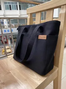 Black canvas tote bag, casual shoulder bag for women, large capacity daily commuter handbag.