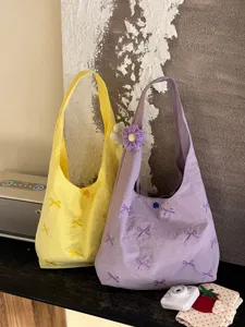 Canvas embroidered tote bag with cute bow design, large capacity casual shoulder bag for use.