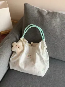 Cute rabbit print canvas shoulder bag with green handles and star pendant for daily commuting