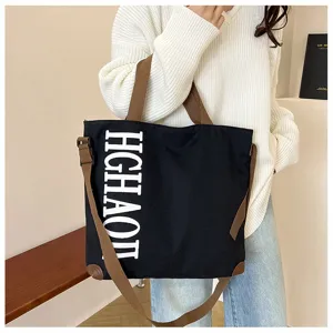 Grand sac cabas en toile pour femme decontracte polyvalent sac noir avec laniere marron.