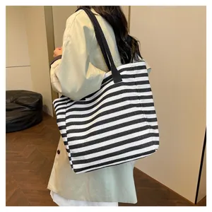 Casual black and white striped canvas tote bag for women, large capacity daily shoulder bag.