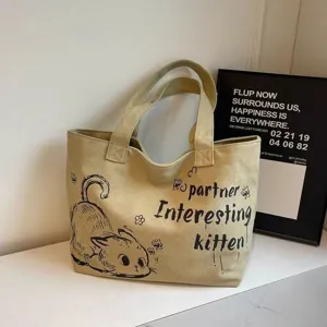 Detailed view of the casual canvas tote bag with cute cat print, spacious capacity, daily commuting.