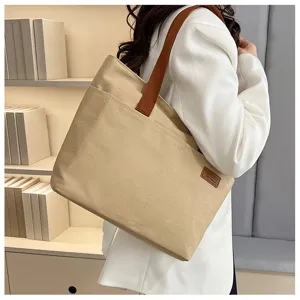 Casual canvas tote bag for women, large capacity shoulder bag for daily commute and students.