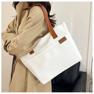 Canvas tote bag for women, large capacity casual shoulder bag, stylish commuter handbag.