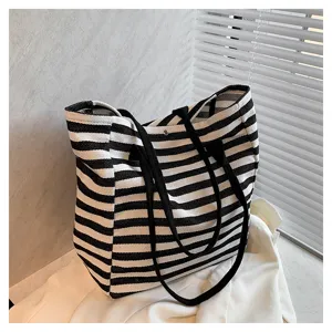 Black and white striped canvas tote bag for women, large capacity casual shoulder bag.