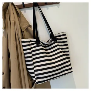 Black and white striped canvas tote bag, large capacity shoulder handbag for women daily commute.