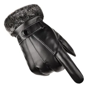 Close-up details of warm winter leather gloves with soft furry cuffs and decorative stitching.