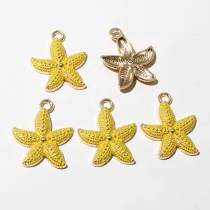 Close-up detail of yellow enamel starfish alloy DIY jewelry pendant charm hanging loop piece