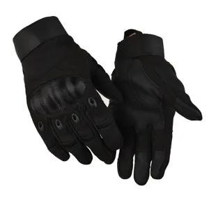 Detail view of black tactical gloves featuring hard knuckle protection and durable anti-slip material.