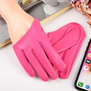 Close-up detail shot of hot pink PU leather gloves, ideal for stage performance and club wear.