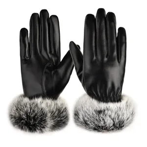 Close up view of black PU leather winter warm gloves featuring luxurious soft fur cuffs.