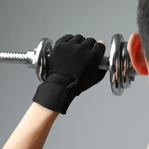 Detail shot of black half-finger fitness gloves with wrist support for weightlifting workout.