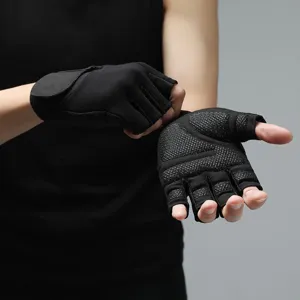 Detail view of anti-slip half-finger fitness gloves for weightlifting and gym training.