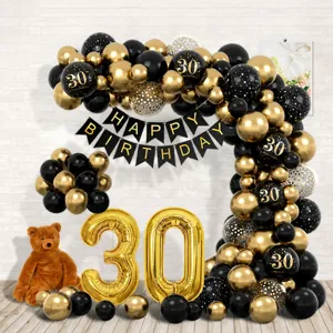 Black gold birthday party balloon arch kit with number 30 balloons and banner for celebration.