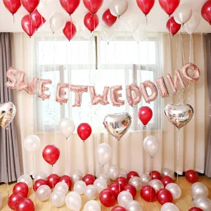 Wedding balloon decoration set with red white latex balloons and sweet wedding foil letters.