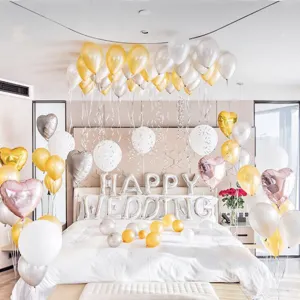 Wedding room balloon decoration set, latex and foil heart balloons for romantic party setup.
