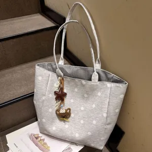 Grey polka dot tote bag detail, large capacity shoulder bag with cute bear charm and stripes.