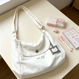 Casual white canvas shoulder bag with cute cat embroidery, large capacity daily tote handbag.