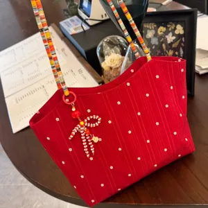 Korean red floral canvas tote bag with colorful beaded straps and bow pendant detail.