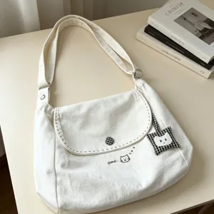 Cute cat canvas shoulder bag for women, large capacity casual crossbody tote for daily use.