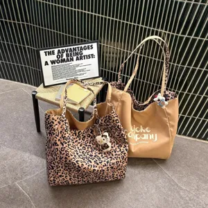 Leopard print canvas tote bag, large capacity casual shoulder bag for women daily commuting.