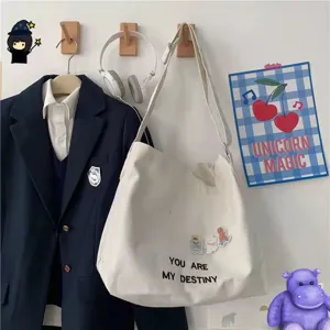 Large capacity canvas tote bag casual shoulder crossbody bag with letter print for women.