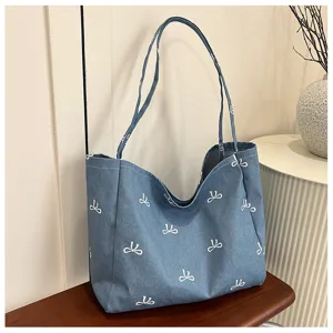 Blue denim canvas tote bag with white bow print, casual large capacity women shoulder bag.