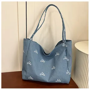 Casual denim canvas tote bag featuring a cute white bow print, spacious daily shoulder bag.