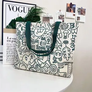 Large capacity canvas tote bag for women with trendy doodle design and green shoulder straps.