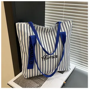 Blue and white striped canvas tote bag, large capacity casual shoulder bag for daily commute.