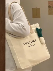 Casual canvas tote bag for women, large capacity shoulder bag for daily commute and school.