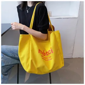 Yellow canvas tote bag for women, large capacity casual single shoulder bag for daily commuting.