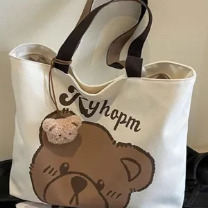 Casual canvas tote bag with cute bear print and plush pendant, large capacity for daily use.