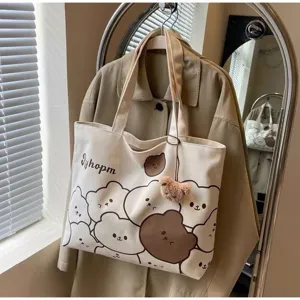 Cute cartoon bear print canvas tote bag, large capacity commuter shoulder handbag for students.