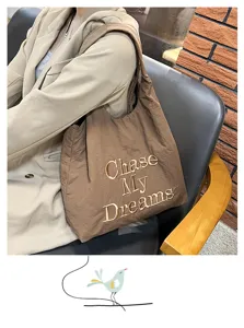 Detailed view of the casual nylon tote bag featuring embroidered English letters and large capacity.