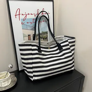 Black and white striped canvas tote bag for women, large capacity commuter shoulder bag.