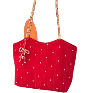 Korean red floral canvas tote bag with colorful braided strap and cute beaded bow pendant.