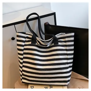 Black and white striped canvas tote bag for women, large capacity commuter shoulder bag.