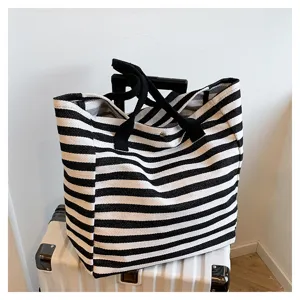 Black and white striped canvas tote bag, large capacity commuter shoulder bag for women daily use.