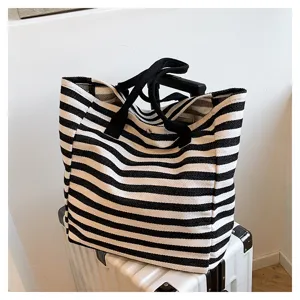 Casual black and white striped canvas tote bag, large capacity shoulder bag for commuting.