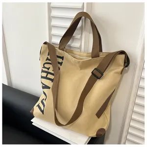 Vue détaillée du sac cabas en toile, sac bandoulière grande capacité décontracté brun.