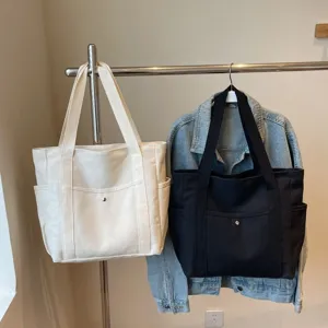 Large capacity canvas tote bag, versatile casual shoulder bag for daily commuting and student use.